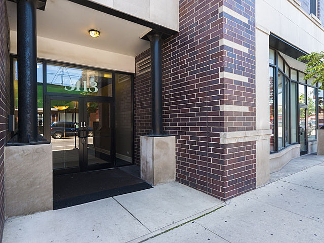 3113 West Lawrence Avenue, Unit D302 Chicago, IL 60625 - Photo 2 of 16 a view of a building with a window