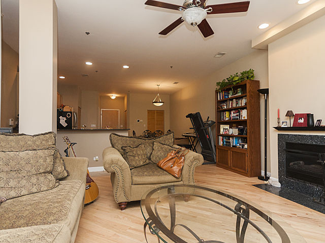 3113 West Lawrence Avenue, Unit D302 Chicago, IL 60625 - Photo 6 of 16 a living room with furniture and a wooden floor