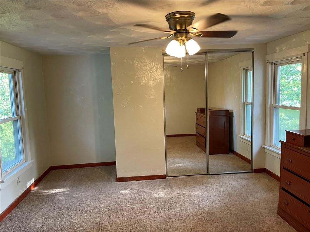 223 Lenkey Road Vanderbilt, PA 15486 - Photo 14 of 18 an empty room with windows and fan