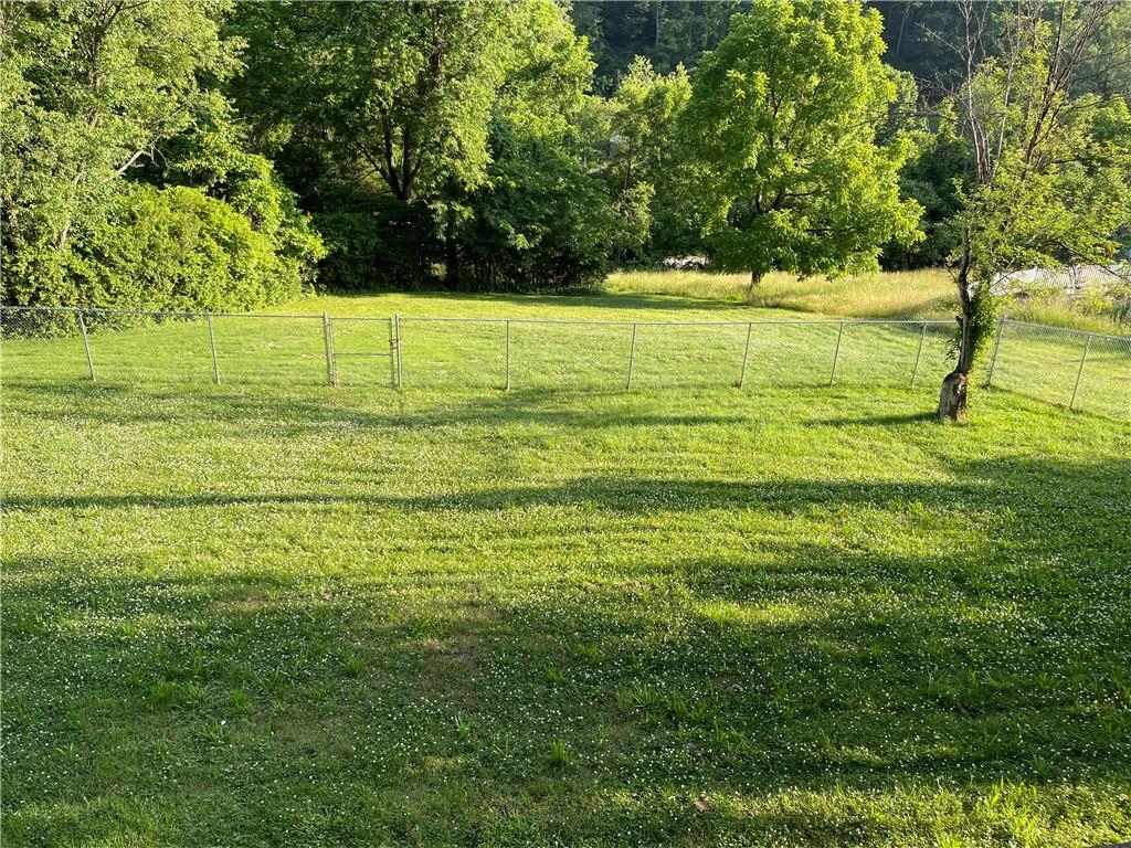 223 Lenkey Road Vanderbilt, PA 15486 - Photo 15 of 18 a view of a yard with an outdoor space
