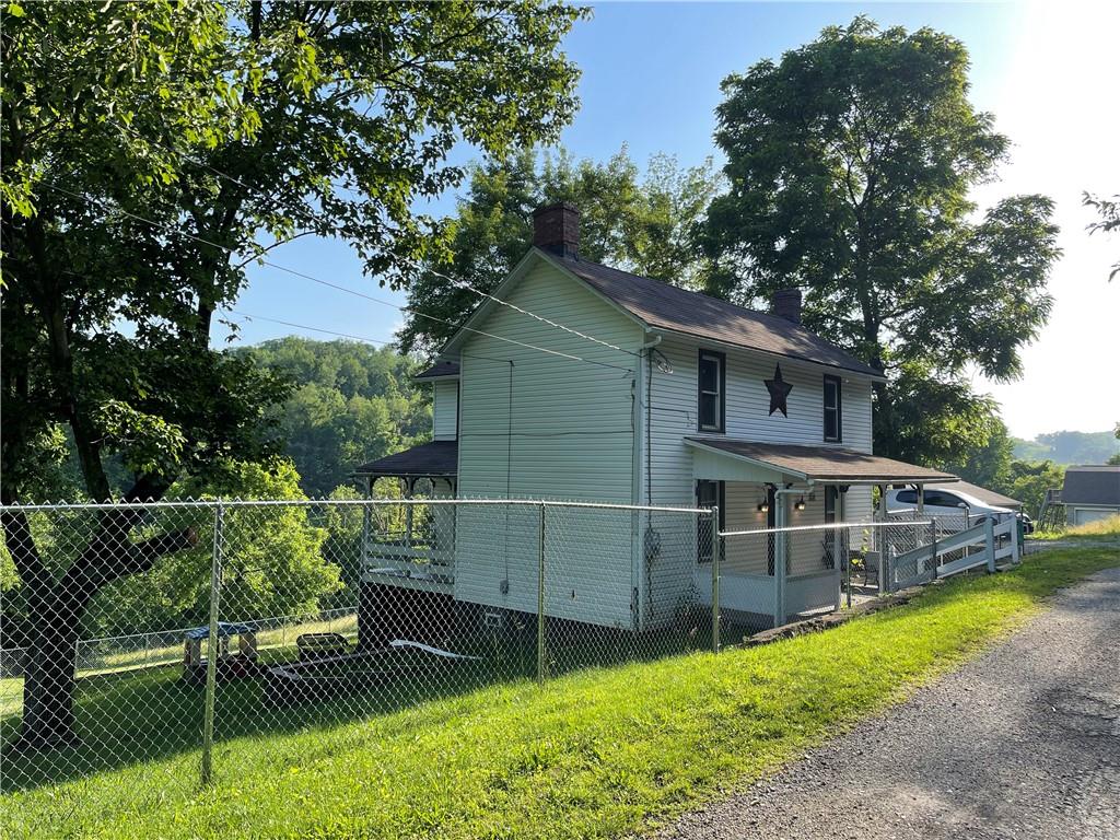 223 Lenkey Road Vanderbilt, PA 15486 - Photo 2 of 18 a view of backyard with green space