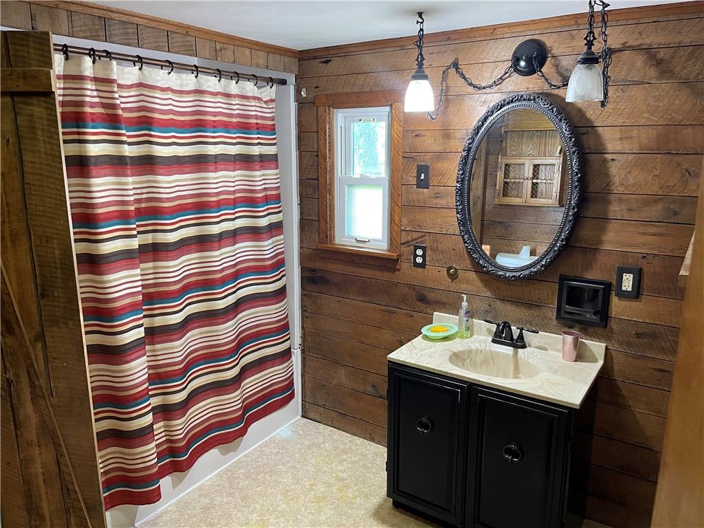 223 Lenkey Road Vanderbilt, PA 15486 - Photo 6 of 18 a bathroom with a sink a mirror and a shower curtain