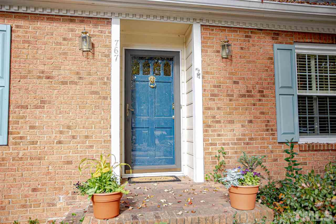 767 Weathergreen Drive Raleigh, NC 27615 - Photo 2 of 21 a front view of a house with potted plants