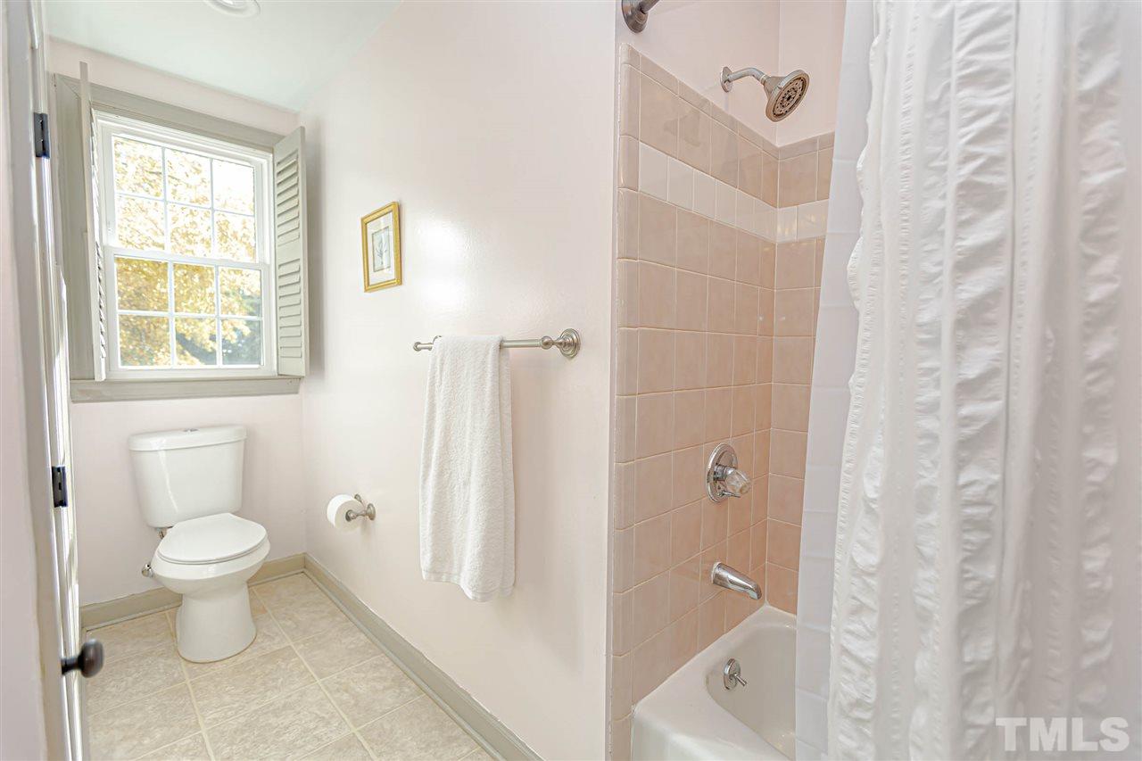 767 Weathergreen Drive Raleigh, NC 27615 - Photo 15 of 21 a bathroom with a sink a toilet and shower