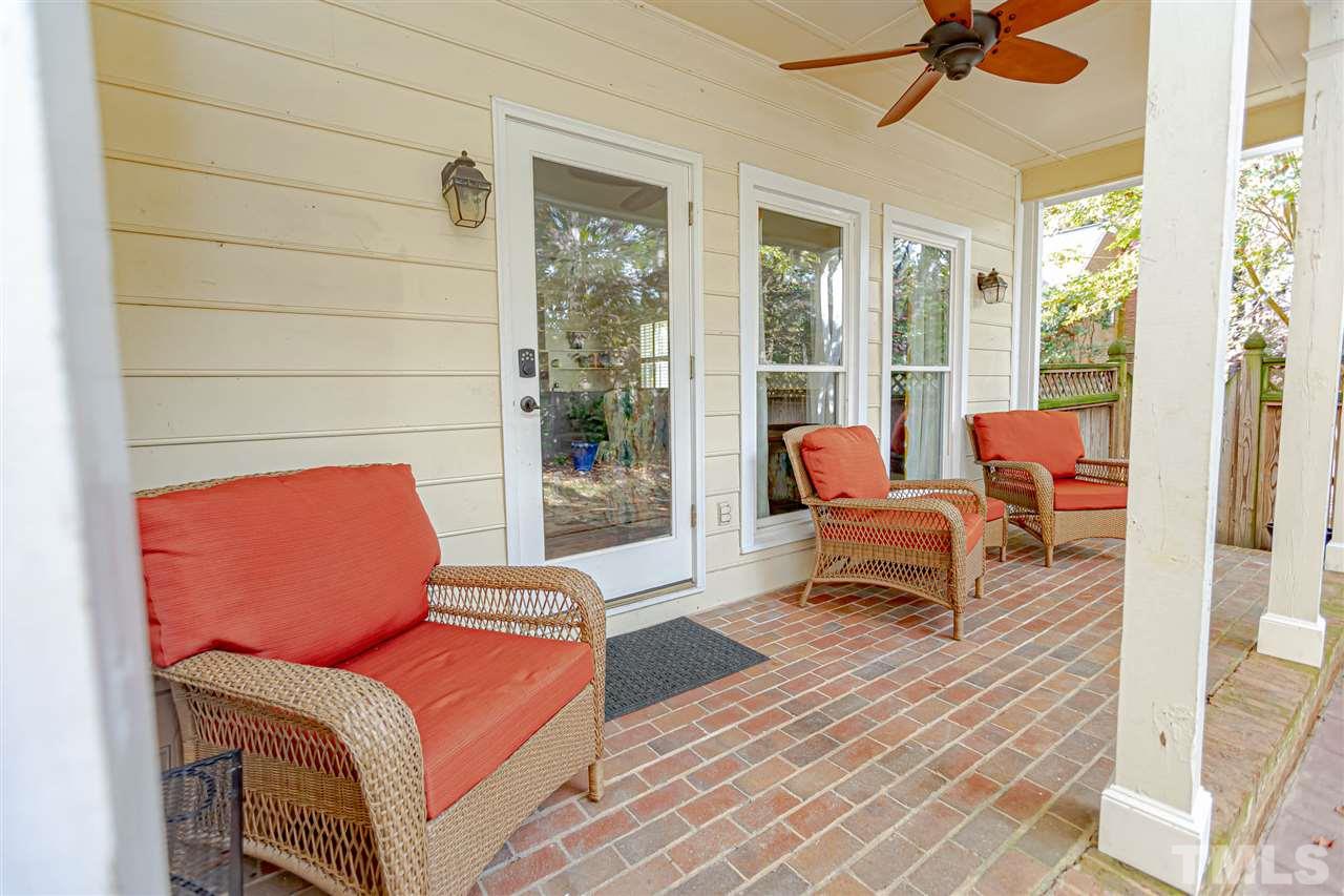 767 Weathergreen Drive Raleigh, NC 27615 - Photo 16 of 21 a living room with furniture and a floor to ceiling window