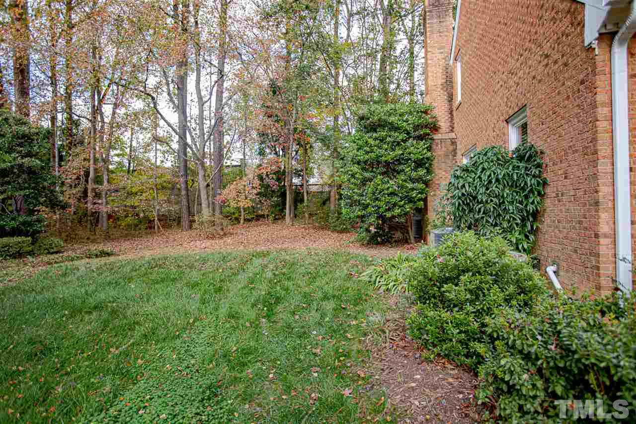767 Weathergreen Drive Raleigh, NC 27615 - Photo 21 of 21 a view of a garden with large trees