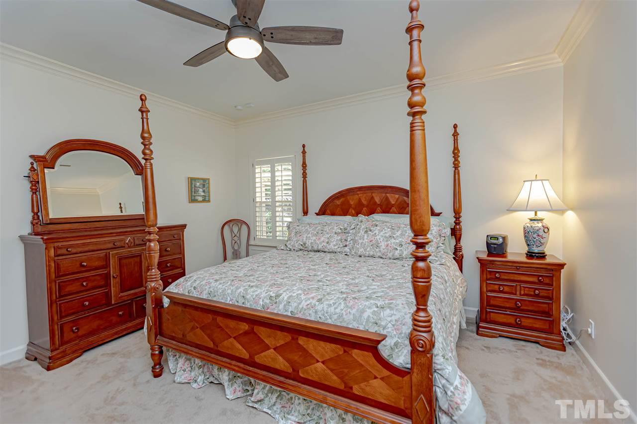 767 Weathergreen Drive Raleigh, NC 27615 - Photo 9 of 21 a bedroom with a bed and dresser