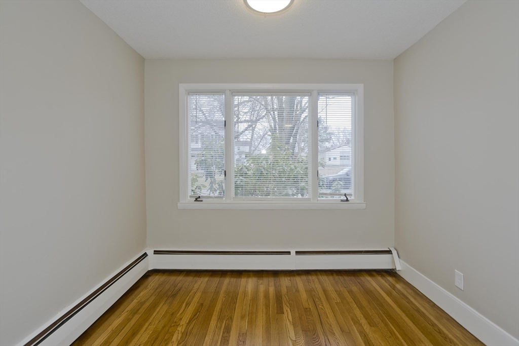 177 Marion Street Chicopee, MA 01013 - Photo 24 of 36 a view of a room with wooden floor and a window