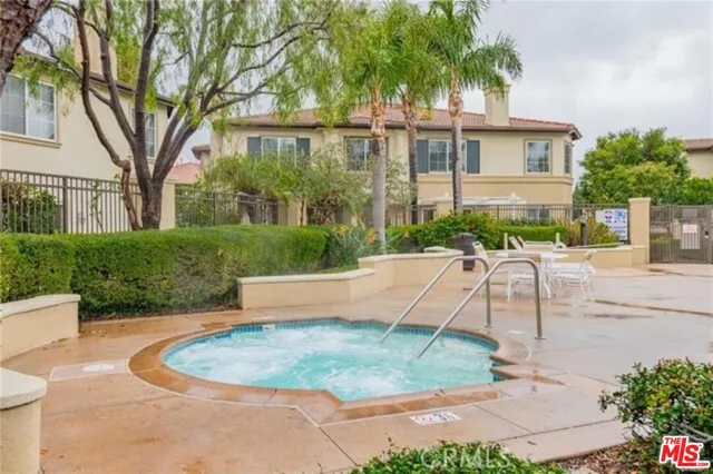 a view of multiple houses with a yard