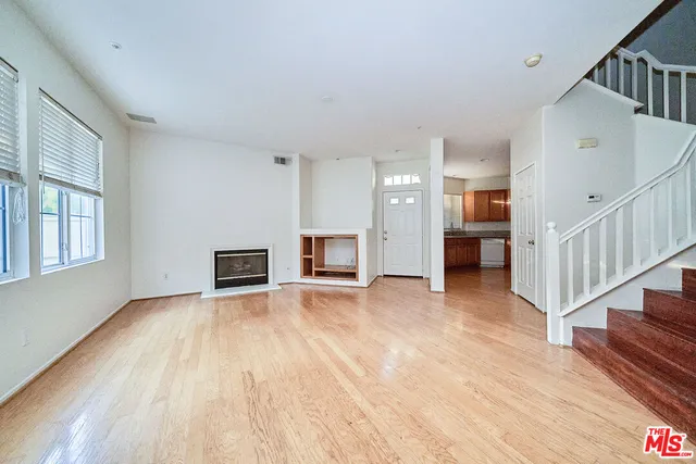 a view of livingroom with hardwood floor and fireplace