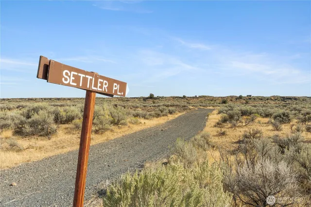 a aerial view of a house next to a big yard