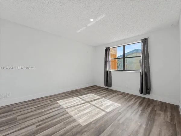 a bedroom with a bed and furniture