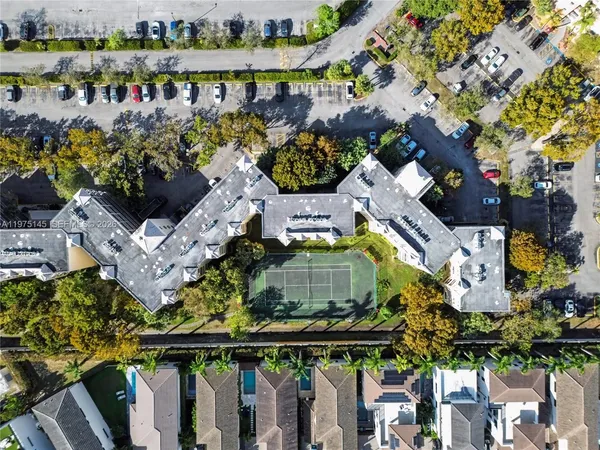 an aerial view of residential houses with outdoor space