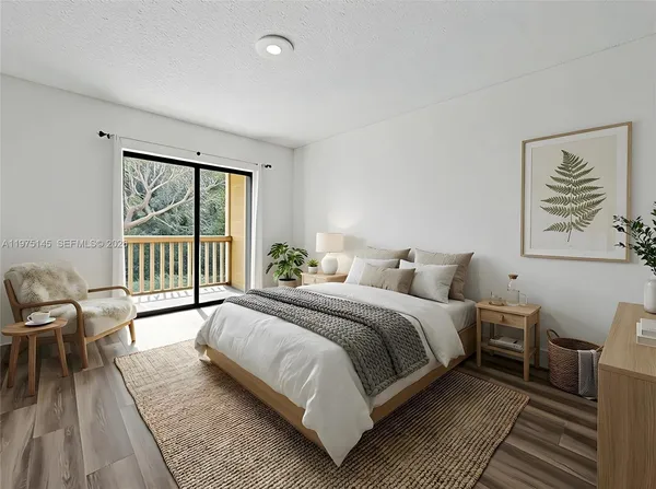 a view of a two chairs in the balcony