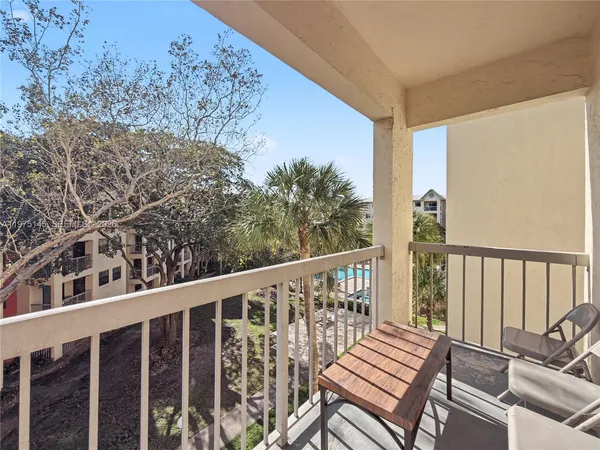 a view of a balcony with wooden floor