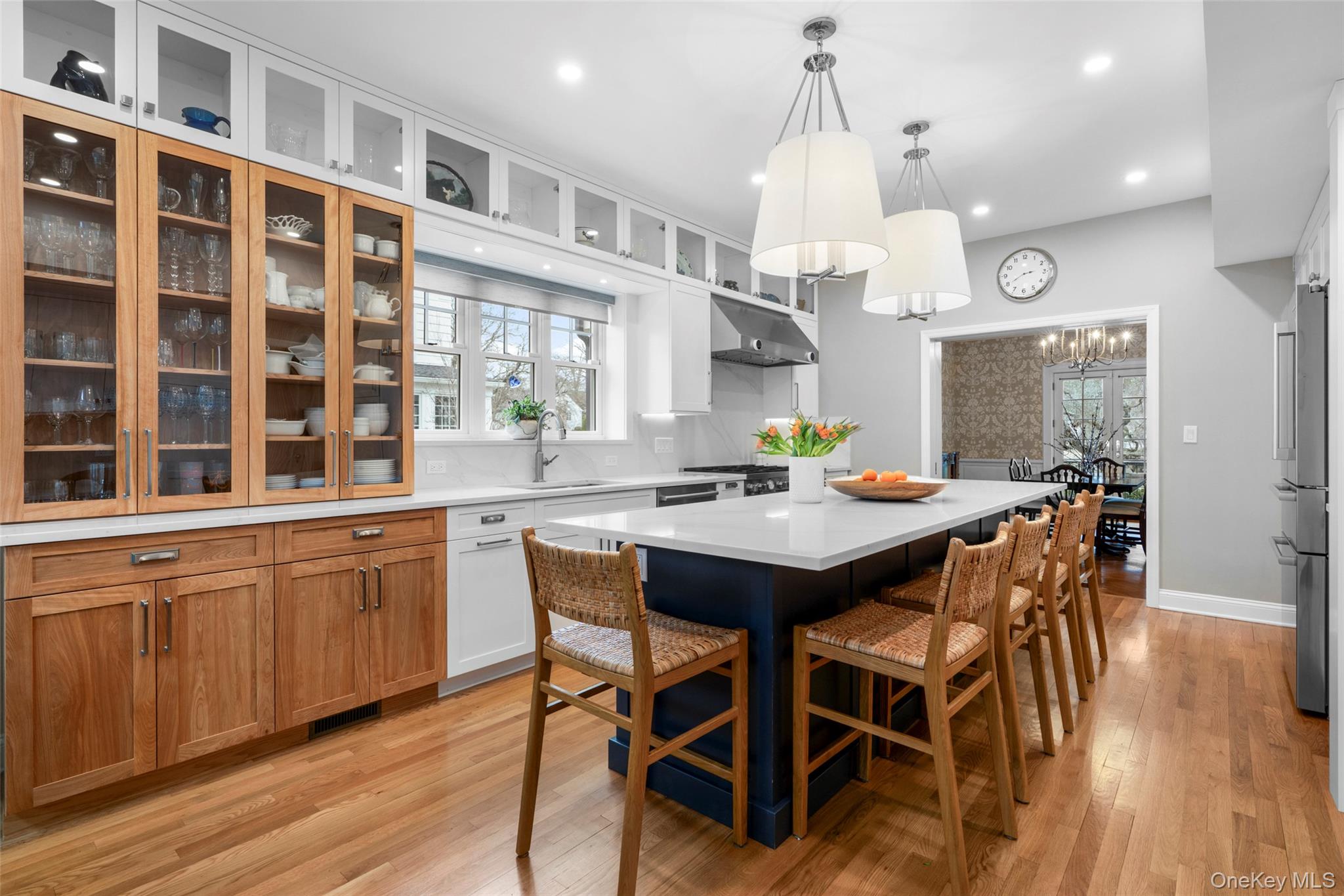80 Forest Avenue New Rochelle, NY 10804 - Photo 14 of 48 a kitchen with granite countertop a dining table chairs and wooden floor