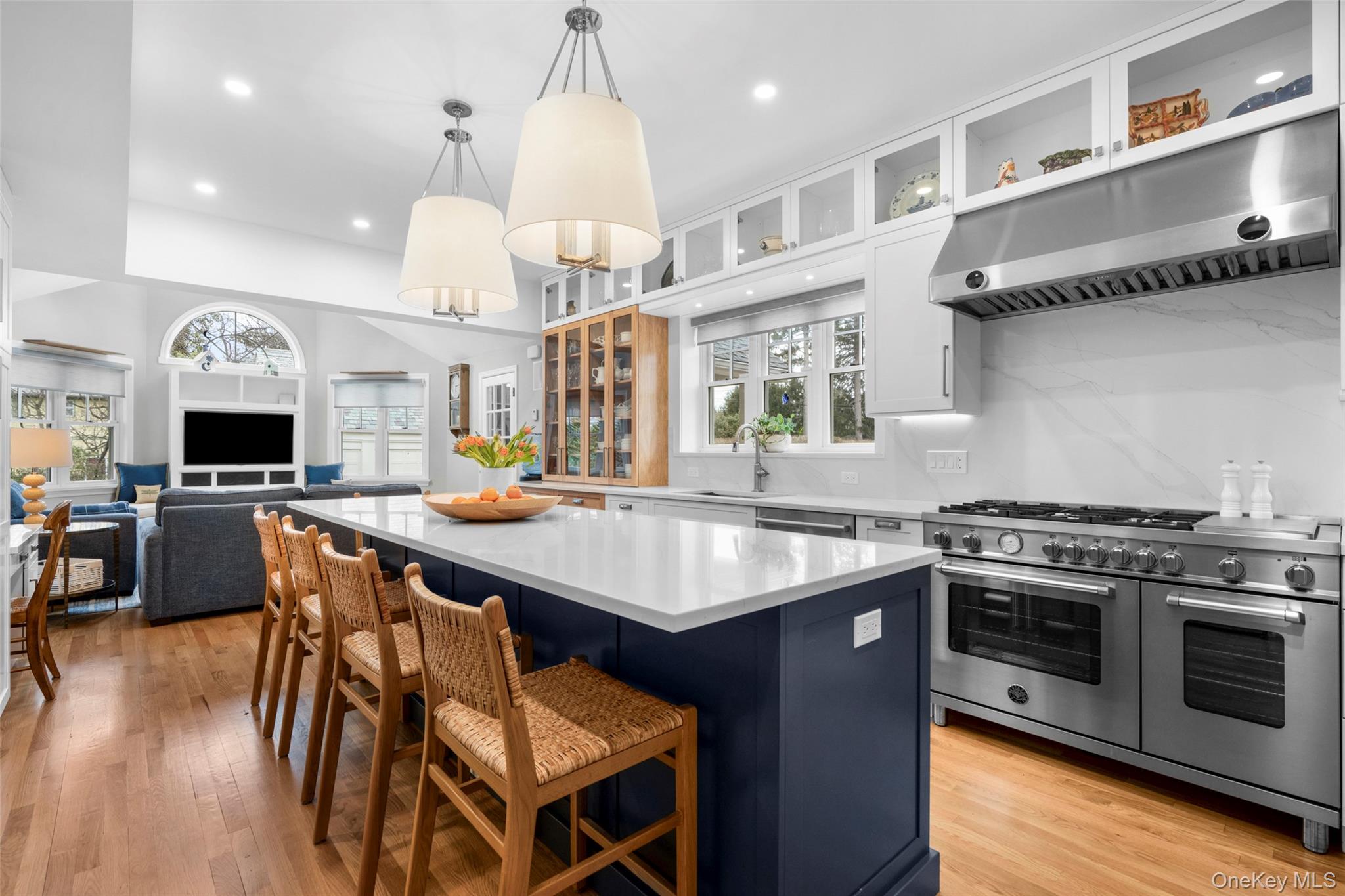 80 Forest Avenue New Rochelle, NY 10804 - Photo 15 of 48 a kitchen with a stove a chandelier and chairs