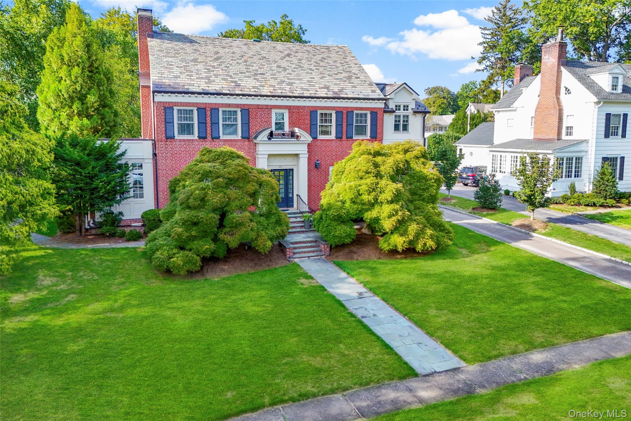 80 Forest Avenue New Rochelle, NY 10804 - Photo 3 of 48 a front view of a house with a yard