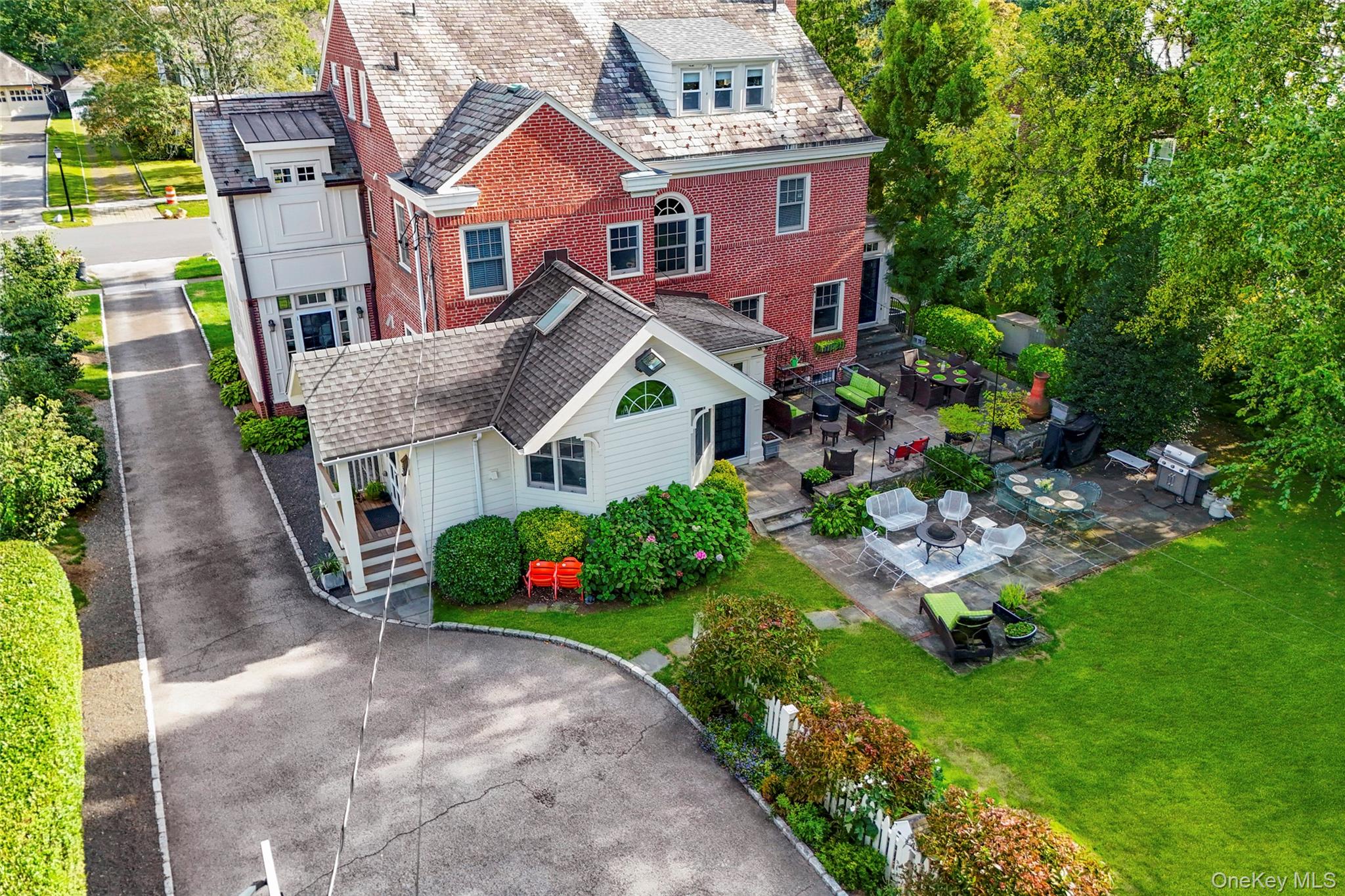 80 Forest Avenue New Rochelle, NY 10804 - Photo 39 of 48 a front view of a house with a garden and plants
