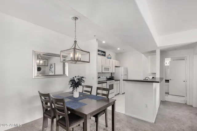 a dining room with furniture and window