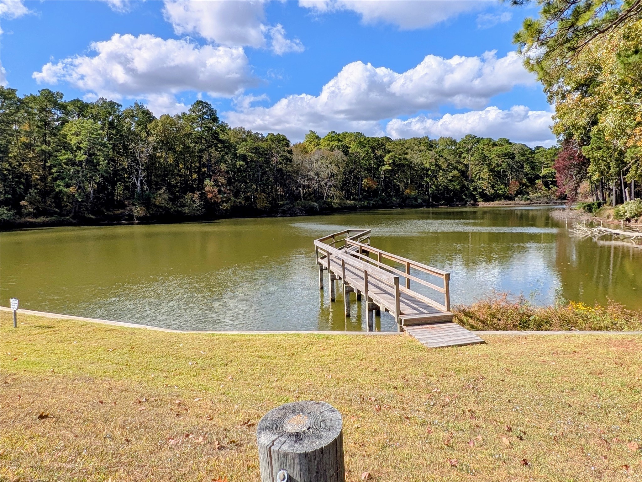 11 Castaway Lane Coldspring, TX 77331 - Photo 16 of 19 a view of a lake with a yard