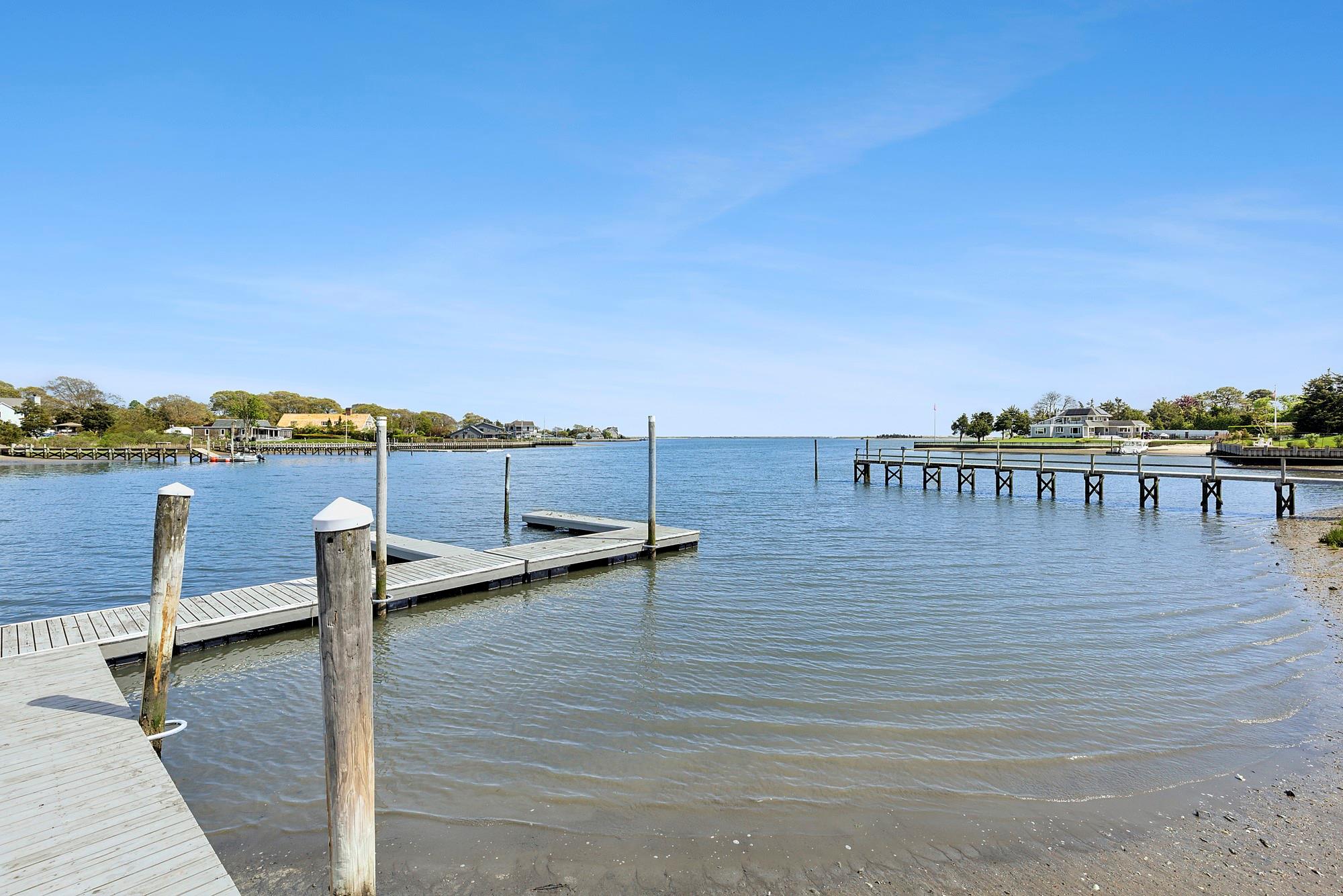 47 Rampasture Road, Unit M Hampton Bays, NY 11946 - Photo 12 of 17 a view of a terrace with chairs