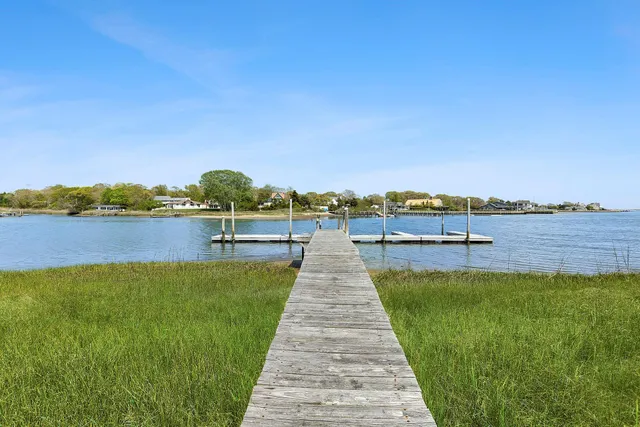 a view of a lake with houses in outdoor space
