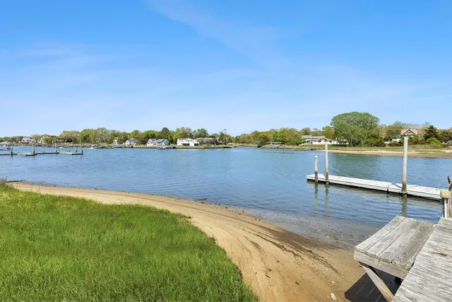 a view of a lake with houses in the background