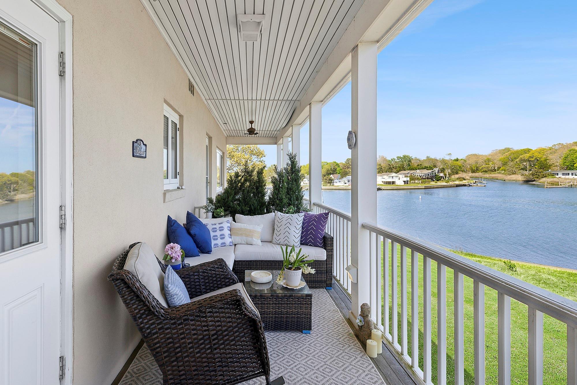 47 Rampasture Road, Unit M Hampton Bays, NY 11946 - Photo 15 of 17 a view of balcony with furniture