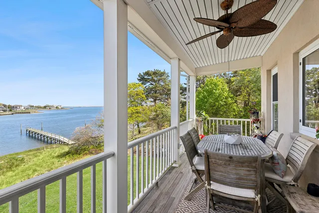 a view of a chair and table in the balcony