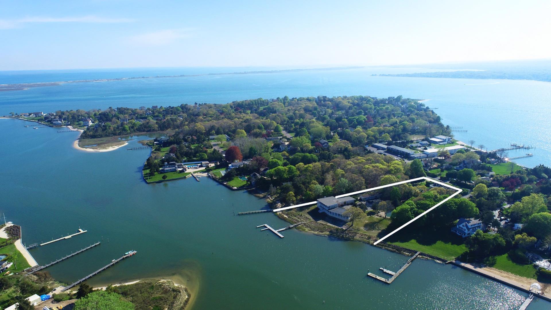 47 Rampasture Road, Unit M Hampton Bays, NY 11946 - Photo 5 of 17 an aerial view of a house with a garden