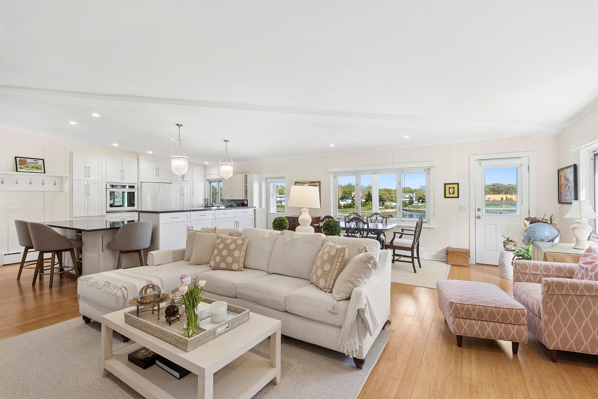 47 Rampasture Road, Unit M Hampton Bays, NY 11946 - Photo 7 of 17 a living room with furniture and wooden floor