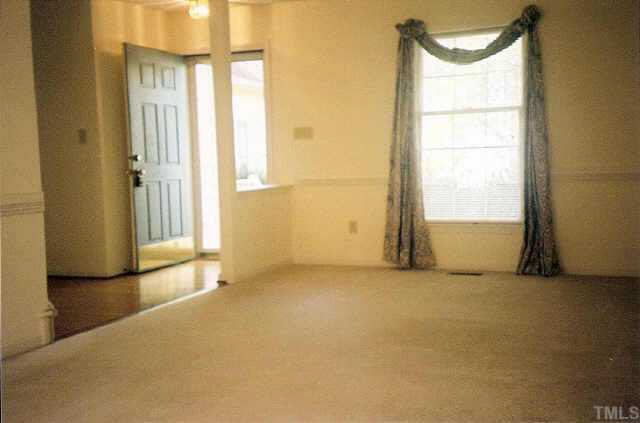5209 Blakeley Lane Raleigh, NC 27613 - Photo 2 of 10 an empty room with window