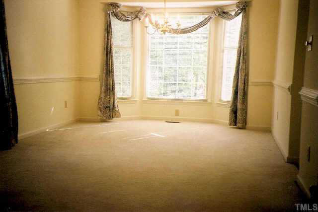 5209 Blakeley Lane Raleigh, NC 27613 - Photo 3 of 10 a view of an empty room with a window