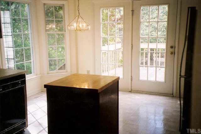 5209 Blakeley Lane Raleigh, NC 27613 - Photo 6 of 10 a kitchen with a stove a sink and a window