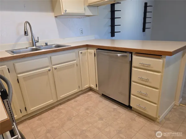 a kitchen with a sink and cabinets