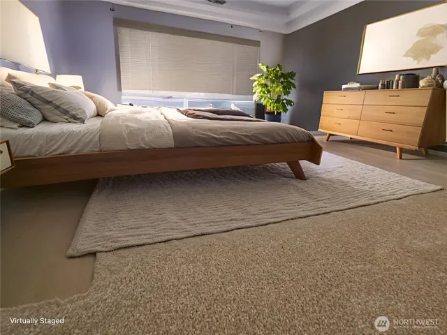 a bedroom with a bed and a dresser