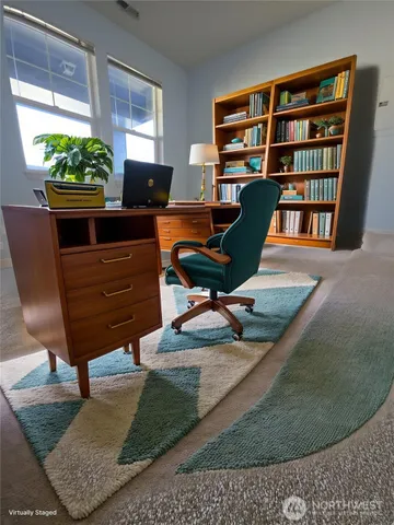 a view of a workspace with furniture