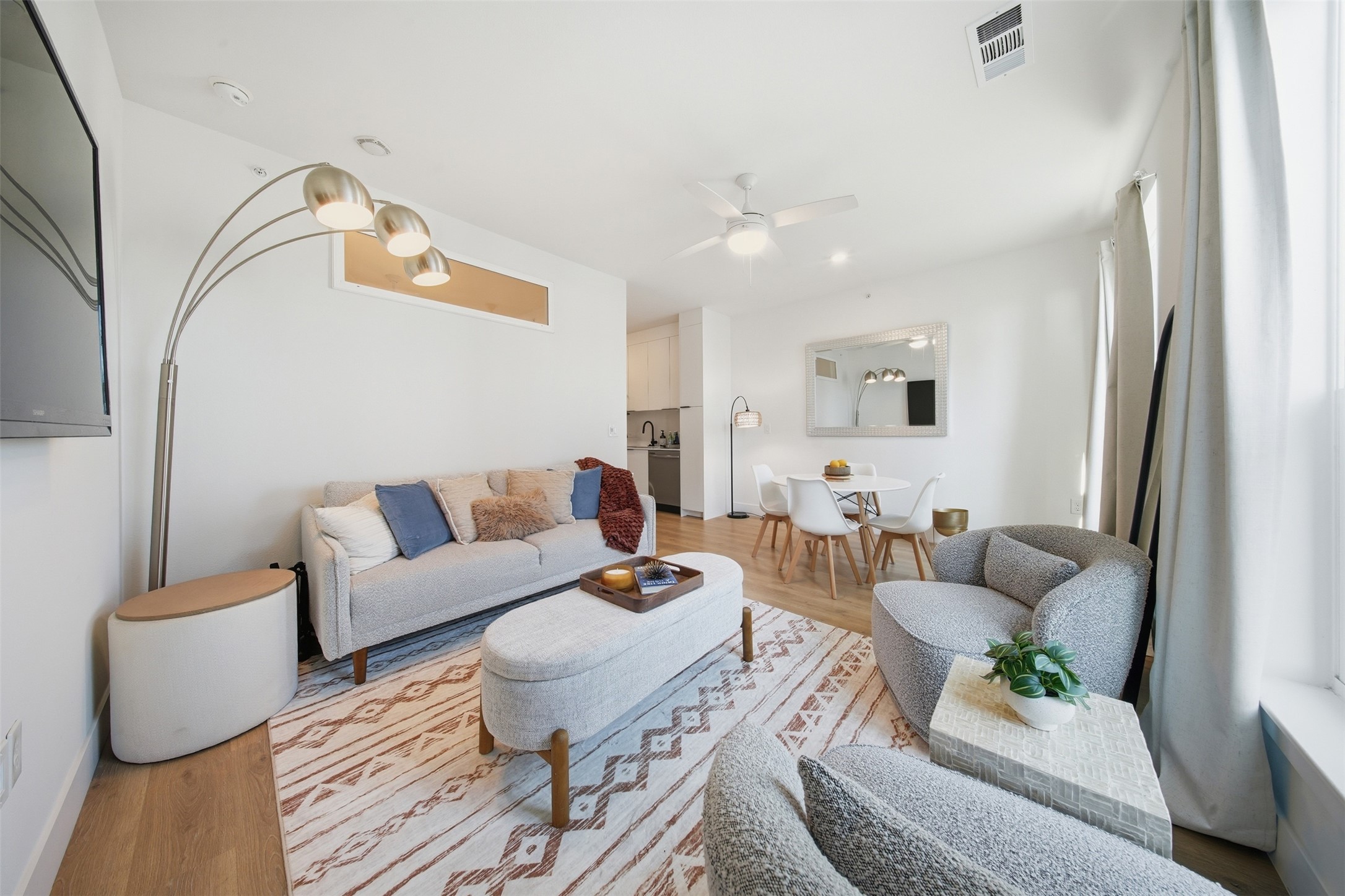 1701 Simond Avenue, Unit 615 Austin, TX 78723 - Photo 5 of 25 Open-concept living space featuring wood-finish flooring, recessed lighting, and a ceiling fan