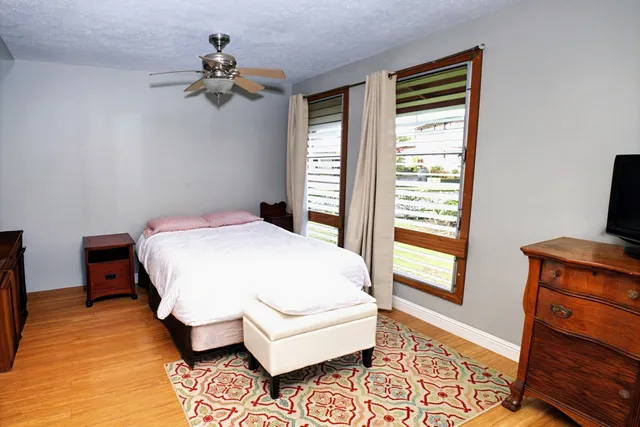 a bed room with a bed and a window