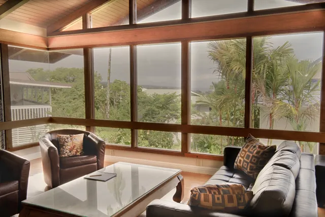 a view of balcony with couch and chairs