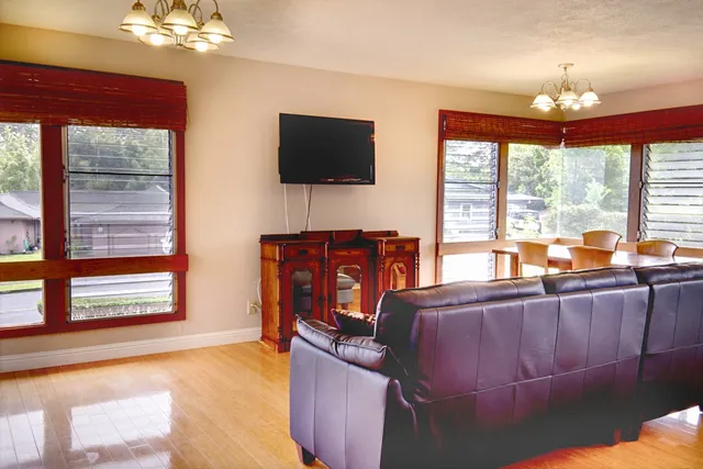 a bed room with furniture and a flat screen tv