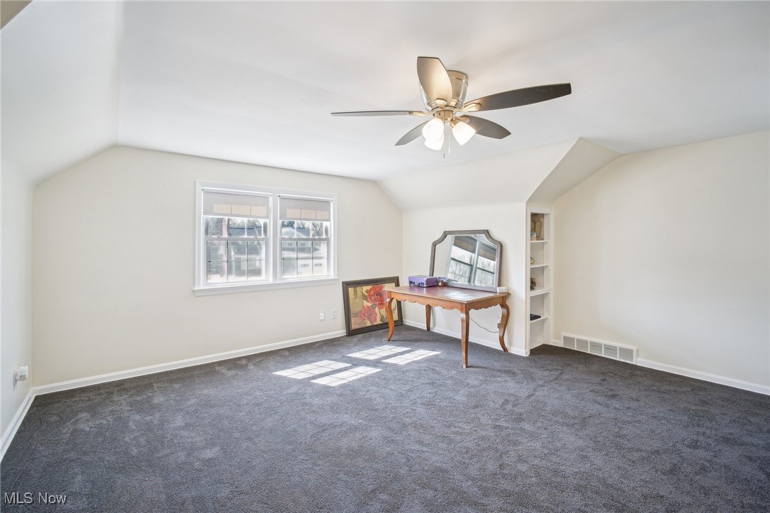 1445 Westover Road Cleveland, OH 44118 - Photo 31 of 47 Additional second floor bedroom with carpeted floor, built-in shelving, and ceiling fan
