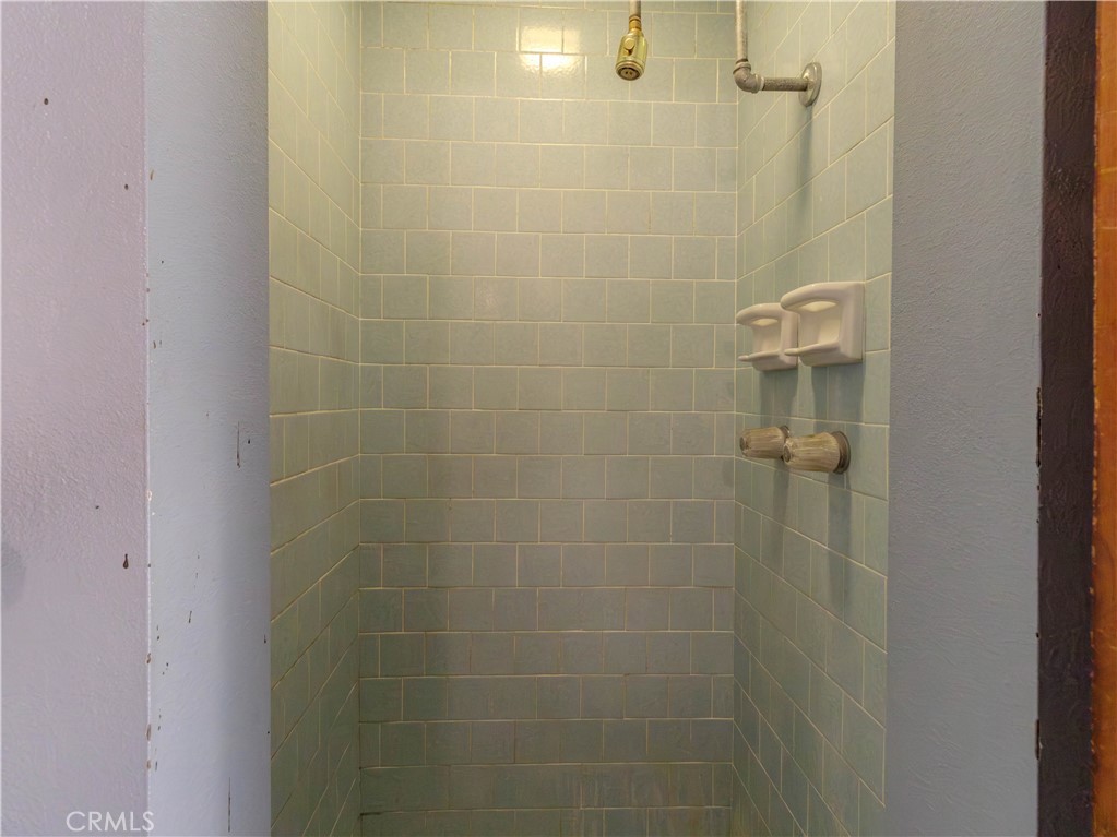 8815 San Vicente Avenue Riverside, CA 92503 - Photo 13 of 27 a bathroom with a shower