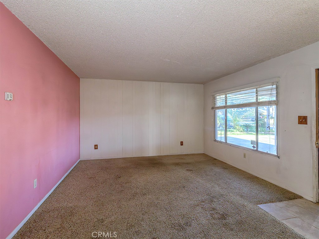 8815 San Vicente Avenue Riverside, CA 92503 - Photo 20 of 27 an empty room with a empty space and windows
