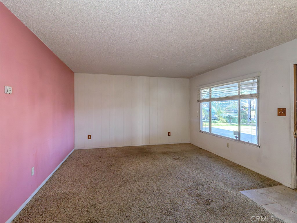 8815 San Vicente Avenue Riverside, CA 92503 - Photo 9 of 27 an empty room with a empty space and windows