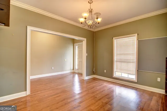 a view of livingroom with window and wooden floor
