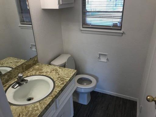 1609 38th Street Lubbock, TX 79412 - Photo 6 of 8 a bathroom with a sink and toilet