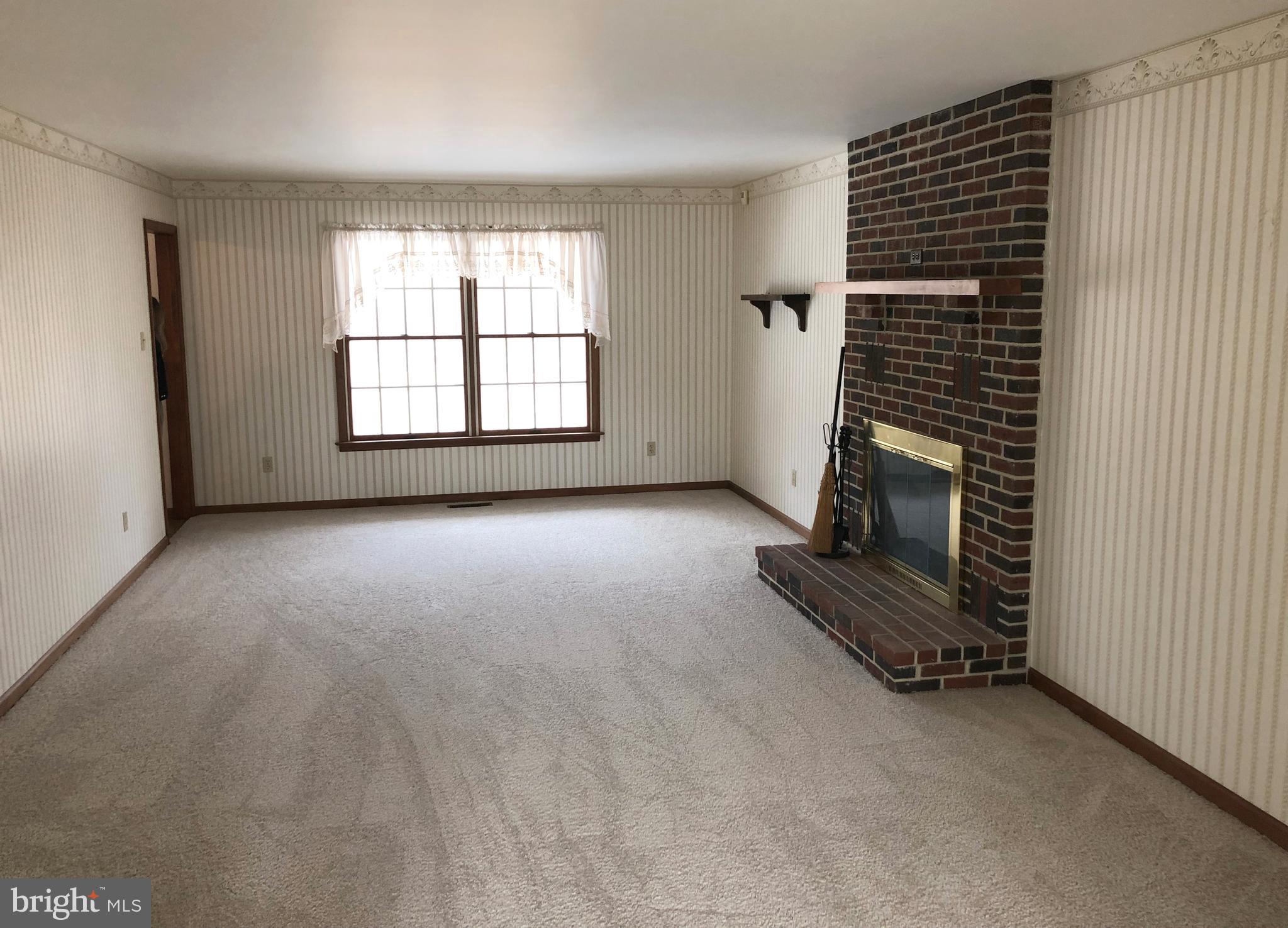 1422 Snyder Road Green Lane, PA 18054 - Photo 4 of 31 Living Room with Wood Fireplace