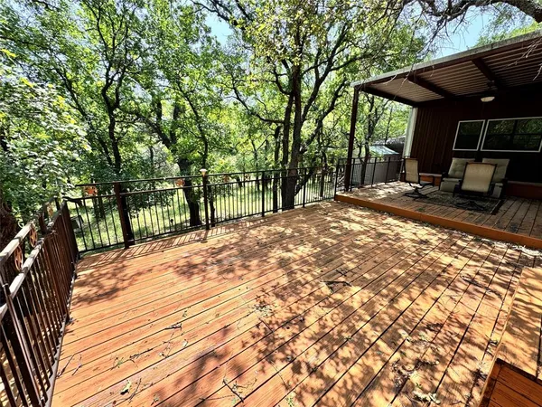 a view of a backyard with sitting area